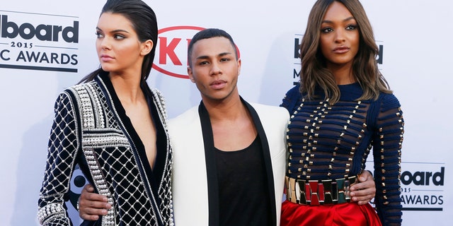 Model Kendall Jenner (L), designer Olivier Rousteing and model Jourdan Dunn arrive in H&amp;M Balmain pieces at the 2015 Billboard Music Awards in Las Vegas, Nevada May 17, 2015.