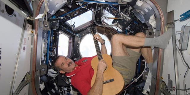Astronaut Chris Hadfield's tweeting and guitar-strumming from orbit make him a popular draw with worldwide audiences.