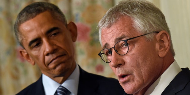 Nov. 24, 2014: President Barack Obama, left, looking to Defense Secretary Chuck Hagel, right, as he talks about his resignation during an event in the State Dining Room of the White House in Washington.