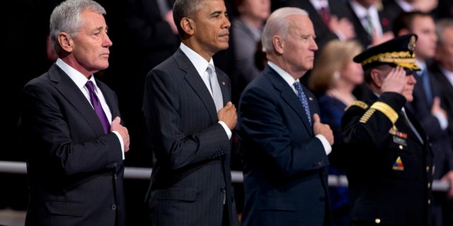 Jan. 28, 2015: From left, outgoing Defense Secretary Chuck Hagel, President Barack Obama,Vice President Joe Biden and Joint Chiefs Chairman Gen. Martin Dempsey, put their hands over their heart as the National Anthem is played during the farewell tribute in honor of Hagel.