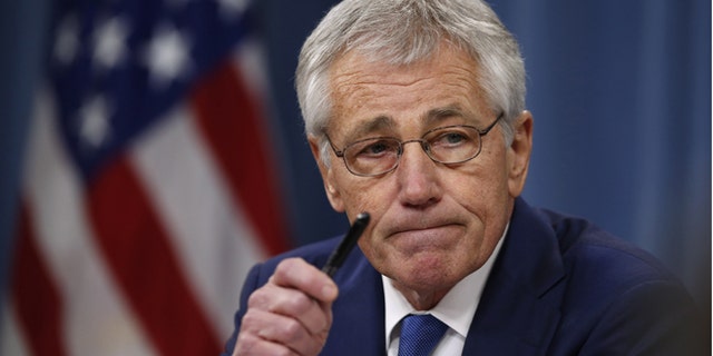Dec. 19, 2013: Defense Secretary Chuck Hagel takes questions as he briefs reporters at the Pentagon in Washington.