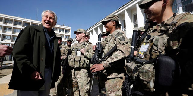 March 10, 2013: U.S. Defense Secretary Chuck Hagel, left, meets with U.S. Army troops during his visit to the Kabul Military Training Center in Kabul, Afghanistan. Hagel said he believes U.S. officials will be able to work things out with Afghan leaders who have ordered special operations forces out of Wardak province, even as commandos face a Monday deadline to leave.