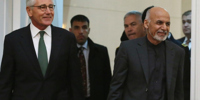 Dec. 6, 2014: Afghan President Ashraf Ghani, right and and U.S. Secretary of Defense Chuck Hagel (L) walk into a news conference at the Presidential Palace in Kabul, Afghanistan.(AP)