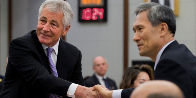 Oct. 2, 2013: U.S. Secretary of Defense Chuck Hagel, left, and South Korean Defense Minister Kim Kwan-jin, shake hands for a photograph at the 45th Security Consultative Meeting at Dfense Ministry in Seoul, South Korea.