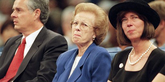 In this Oct. 17,1997 file photo Ramona Hahn, wife of the late supervisor Kenneth Hahn flanked by her son Jim, left and daughter, Janice, during a memorial service for her husband at the Crenshaw Christian Center in Los Angeles. Ramona Hahn, the matriarch of a Los Angeles political family, has died at 86. Hahn was the wife of the late Los Angeles County Supervisor Kenneth Hahn, and the mother of former Mayor James Hahn and City Councilwoman Janice Hahn.