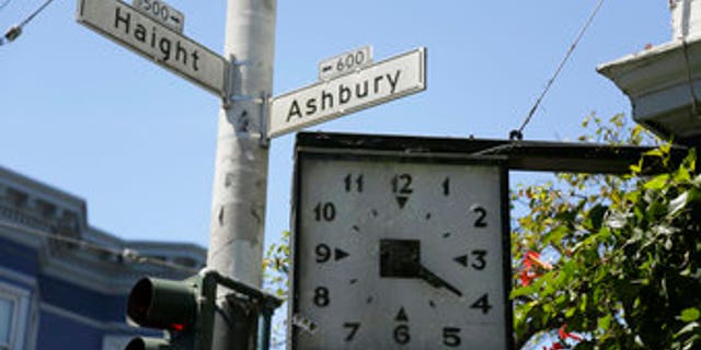 In this Monday, May 22, 2017 photo, a clock remains stuck at 4:20 on the corner of Haight and Ashbury streets in San Francisco. They came for the music, the mind-bending drugs, to resist the Vietnam War and 1960s American orthodoxy, or simply to escape summer boredom. And they left an enduring legacy. Fifty years ago, throngs of American youth descended on San Francisco to join a cultural revolution. (AP Photo/Eric Risberg)