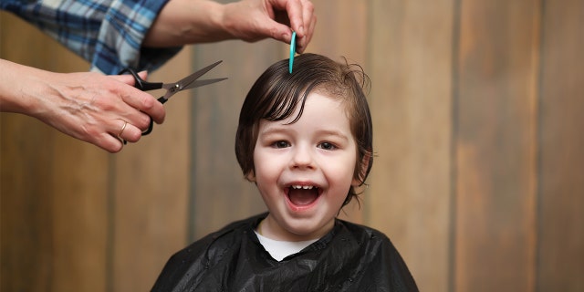 The woman said her stepson (not pictured) was happy with his new short haircut. And after all, the boy did ask her to give him a haircut — and she checked first with the boy's dad, who approved.