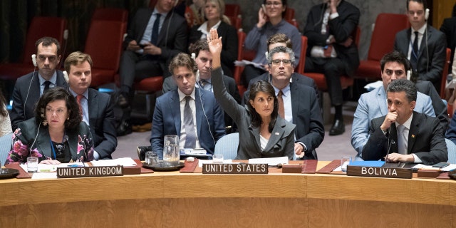 U.S. Ambassador to the United Nations Nikki Haley, center, votes in favor of a resolution introduced by the United States during a Security Council meeting on the situation between the Israelis and the Palestinians, Friday, June 1, 2018 at United Nations headquarters.