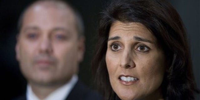 South Carolina state Rep. Nikki Haley talks about allegations of an affair in Greenville, S.C., May 24. She is joined by her husband Michael. (AP Photo)