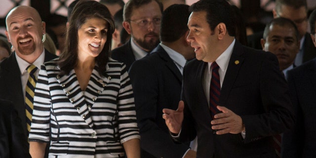 Nikki Haley, U.S. ambassador to the U.N., left, walks with Guatemala's President Jimmy Morales after their meeting at the National Palace of Culture in Guatemala City, Wednesday, Feb. 28, 2018.
