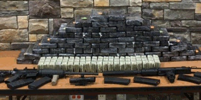 Deputies seized drugs, cash and guns in a raid at teacher's house in Georgia.
