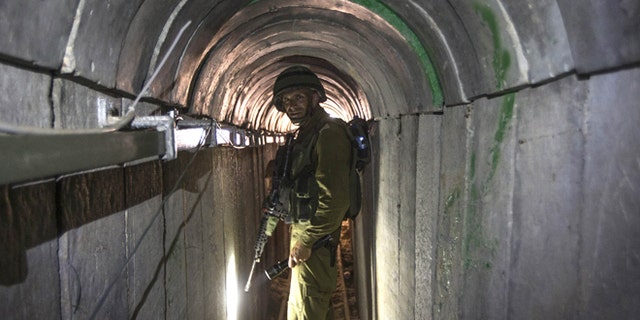 July 25, 2014: In this file photo, an Israeli army officer gives journalists a tour of a tunnel allegedly used by Palestinian militants for cross-border attacks, at the Israel-Gaza Border. (AP)