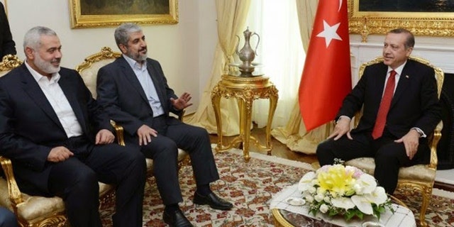 Turkish President Recep Tayyip Erdogan is shown here hosting Hamas leaders Khaled Mashaal and Ismail Haniyeh in June, 2013. Since this meeting Turkey's ties to Hamas have increased. [Turkish Prime Minister's Press Office]