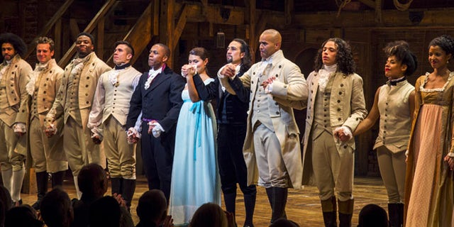 August 6, 2015: Lin-Manuel Miranda (5th right), actor and creator of the of the play 'Hamilton' bows to the audience after opening night of the play on Broadway in New York.