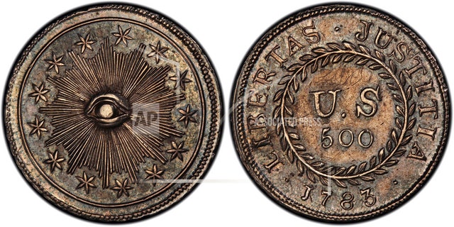 This image provided by PCGS.com/Professional Coin Grading Service shows the front, left, and back of a 1783 plain obverse Nova Constellatio Quint silver coin. Authorized by Congress, the coin had a value of 500 units in a proposed but later abandoned early American decimal monetary system that would have ranged from 5 to 1,000 units. (Courtesy of PCGS.com via AP)