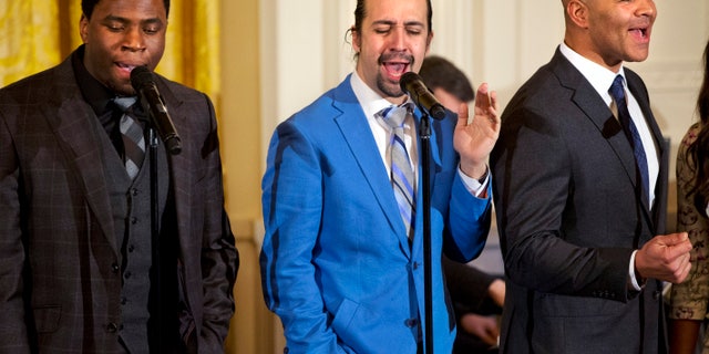 Actor Okieriete Onaodowan, left, actor Lin-Manuel Miranda, and actor Christopher Jackson perform the song "Alexander Hamilton" from the Broadway play "Hamilton" in the East Room of the White House, in Washington, Monday, March 14, 2016. (AP Photo/Jacquelyn Martin)
