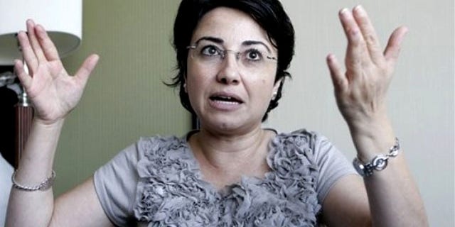 Israeli-Arab Knesset member Hanin Zoabi gestures as she talks to the media in Amman, Jordan, Tuesday, Aug. 31, 2010, after being interviewed by investigators from a U.N. human rights inquiry on the May 31 flotilla attack.