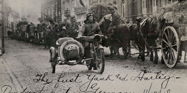 American soldier Roy Holtz rides a motorcycle in Germany the day after WWI ends, according to Harley-Davidson Archives.