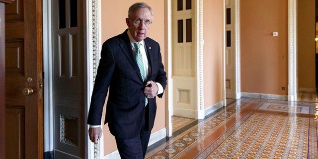 June 24, 2014: Senate Majority Leader Harry Reid of Nevada heads to speak to reporters on Capitol Hill in Washington.
