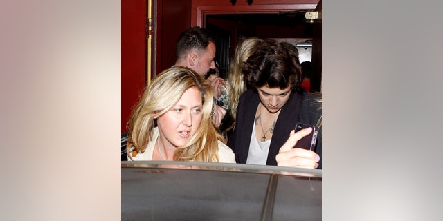 Harry Styles dines with Rod Stewart and his family at Dan Tana's. They were accompanied by Penny Lancaster, Kimberly Stewart and friends as they packed into a Rolls Royce before driving away. April 25, 2013