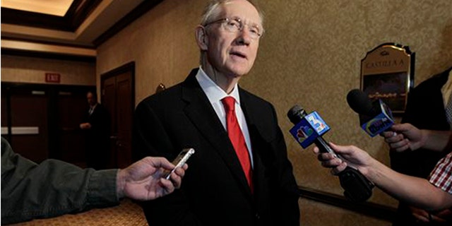 This Aug. 25, 2010 file photo U.S. Sen. Majority Leader Harry Reid answers questions for a member of the media in Las Vegas, Nev.(AP Photo/Julie Jacobson,File)