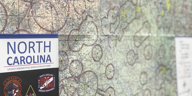 A map of North Carolina's aeronautical search and rescue chart hangs on a wall in the hangar at the U.S. Army National Guard Base in Raleigh, N.C.