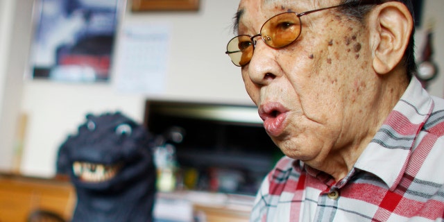 In this April 28, 2014 photo, original Godzilla suit actor Haruo Nakajima, who has played his role as the monster, speaks during an interview at his home in Sagamihara, near Tokyo. Nakajima, the actor who stomped in a rubber suit to portray the original 1954 Godzilla, has died on Monday, Aug. 7, 2017.