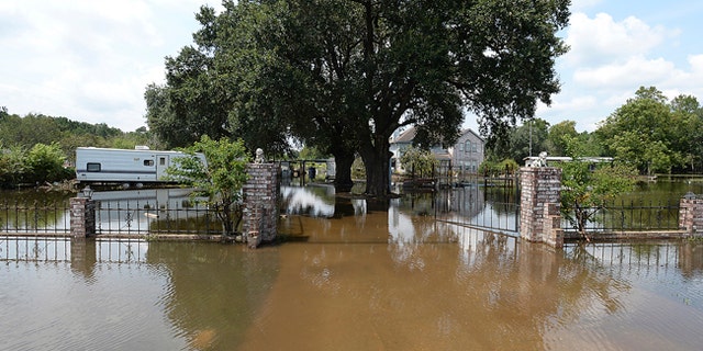 A house is seen flooded in Orange County, Texas, Sunday, Sept. 3, 2017.