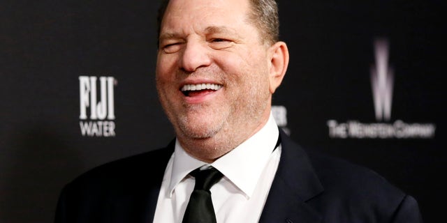 FILE -- Producer Harvey Weinstein smiles as he arrives at The Weinstein Company & Netflix after party after the 71st annual Golden Globe Awards in Beverly Hills, California, January 12, 2014.