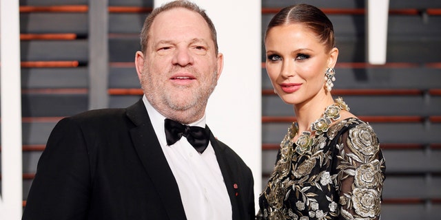 FILE -- Producer Harvey Weinstein and wife, designer Georgina Chapman, arrive at the 2015 Vanity Fair Oscar Party in Beverly Hills, California February 22, 2015.