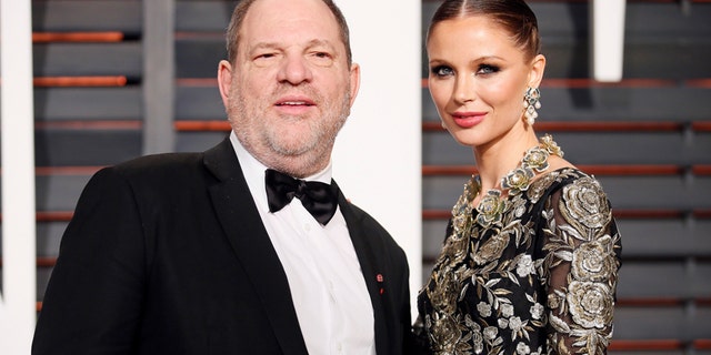 FILE -- Producer Harvey Weinstein and wife, designer Georgina Chapman, arrive at the 2015 Vanity Fair Oscar Party in Beverly Hills, California February 22, 2015.
