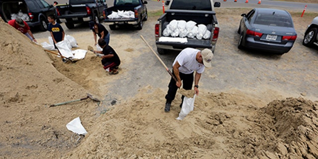 Martin Quintanilla fills sandbags as he and others prepare for Hurricane Harvey, Aug. 24, 2017, in Corpus Christi, Texas.