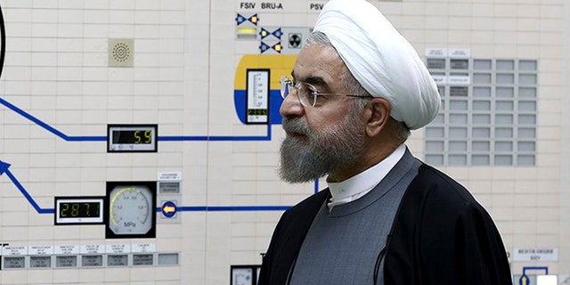 In this photo released by the Iranian Presidency Office, President Hassan Rouhani visits the Bushehr nuclear power plant just outside the port city of Bushehr, southern Iran, Tuesday, Jan. 13, 2015.