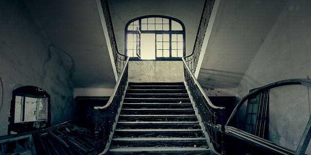 These four scary destinations are all located in America. Seen in this stock image is a set of creepy steps in what appears to be an abandoned building in an undisclosed location.