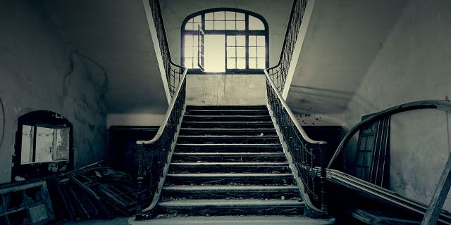 These four scary destinations are all located in America. Seen in this stock image is a set of creepy steps in what appears to be an abandoned building in an undisclosed location.