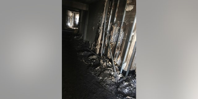 This photo provided by Bruce Campbell, a unit manager in the Marco Polo building in Honolulu, shows the charred interior of the building on Saturday, July 15, 2017.