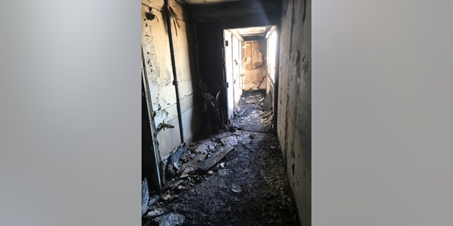 This photo provided by Bruce Campbell, a unit manager in the Marco Polo building in Honolulu, shows the charred interior of the building on Saturday, July 15, 2017.