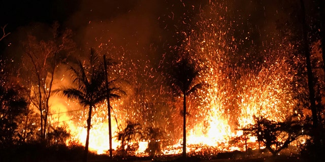 In this Saturday, May 5, 2018 photo, a new fissure erupts in Leilani Estates in Pahoa, Hawaii.