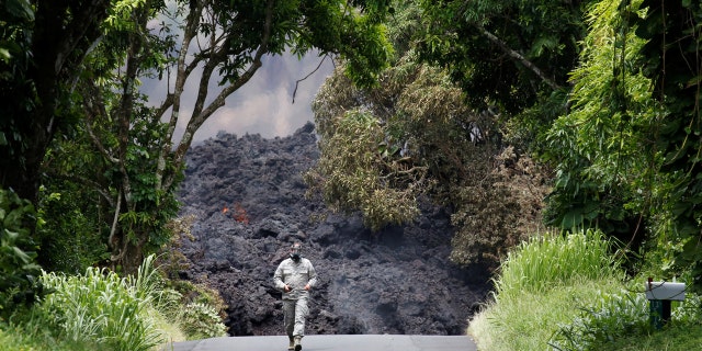 A lava flow on Highway 137 southeast of Pahoa during ongoing eruptions of the Kilauea Volcano.