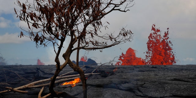 Lava erupts from fissures in the Leilani Estates subdivision near Pahoa, Hawaii, Tuesday, May 22, 2018.