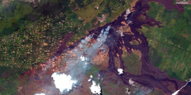 This May 23, 2018, Satellite photo provided by DigitalGlobe shows lava coming out of fissures caused by Kilauea volcano, running towards the Puna coast.
