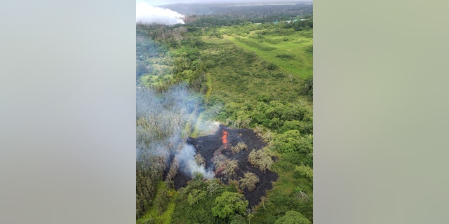This Saturday, May 12, 2018, image released by the Hawi'i County Fire Department, shows an aerial view of fissure 16, located about 1.3 km (0.8 miles) northeast of fissure 15, top left, i9n the Big Island of Hawaii.