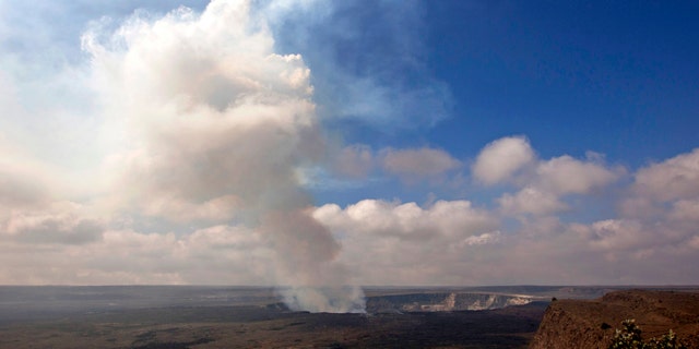 Sept. 1, 2015 photo of volcanic gas rising from the lava lake in Kilauea's Halemaumau Crater (AP Photo/Caleb Jones)