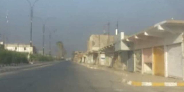 The city of Hawija is a bleak landscape of garbage and deserted buildings.