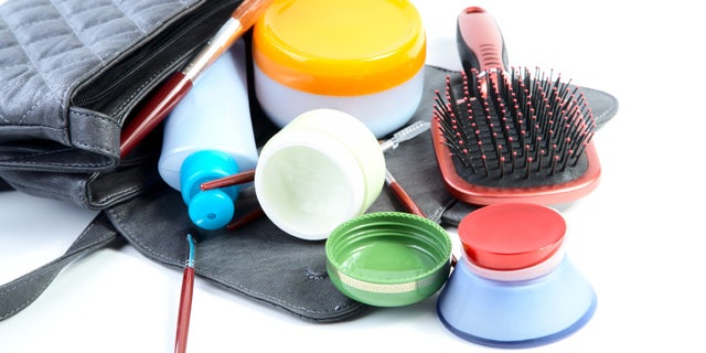 Female bag and cosmetics isolated on a white background