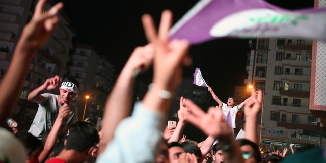 HDP supporters celebrate the party's election results in Diyarbakir, Turkey