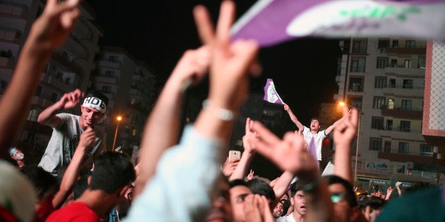 HDP supporters celebrate the party's election results in Diyarbakir, Turkey