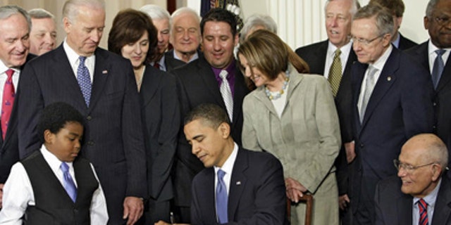 U.S. President Barack Obama singing the Health Care Reform bill in Washington, D.C.
