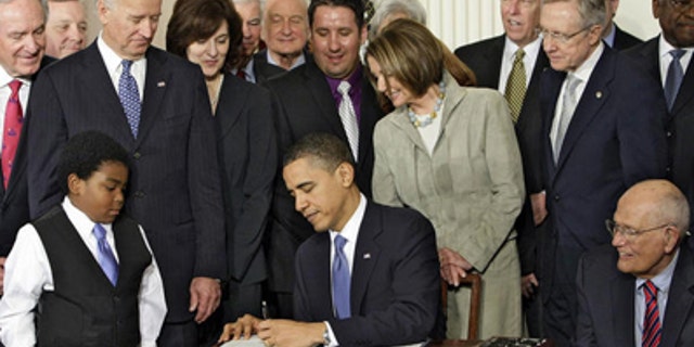 U.S. President Barack Obama singing the Health Care Reform bill in Washington, D.C.