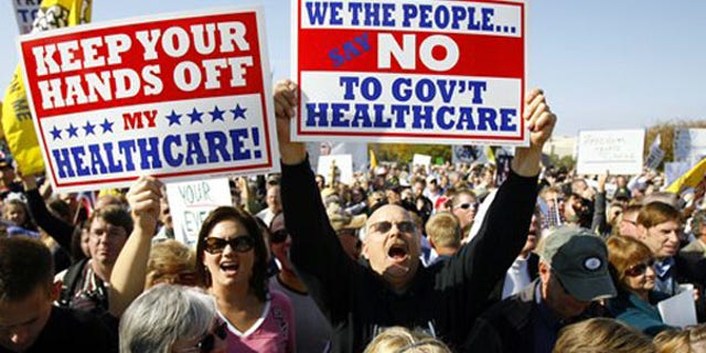 Demonstrators chant on Capitol Hill Nov. 5 during a Republican health care reform rally. (AP Photo)